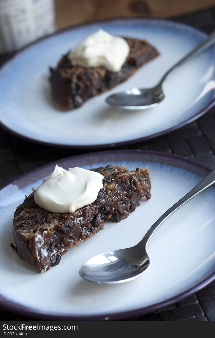 Portion of Christmas pudding topped with creme fraiche