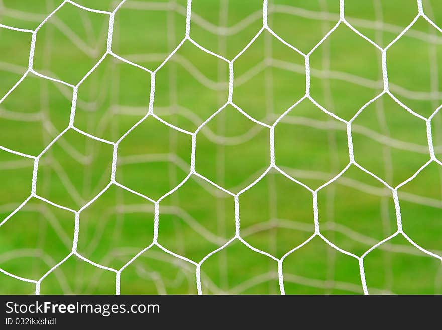 Closeup of soccer net in soccer field