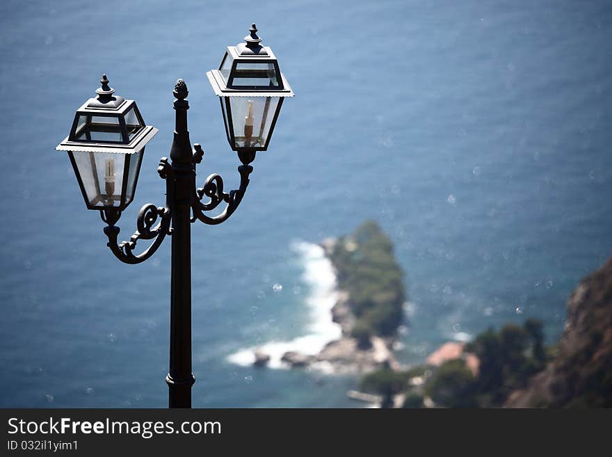 Lantern in park  sea on back