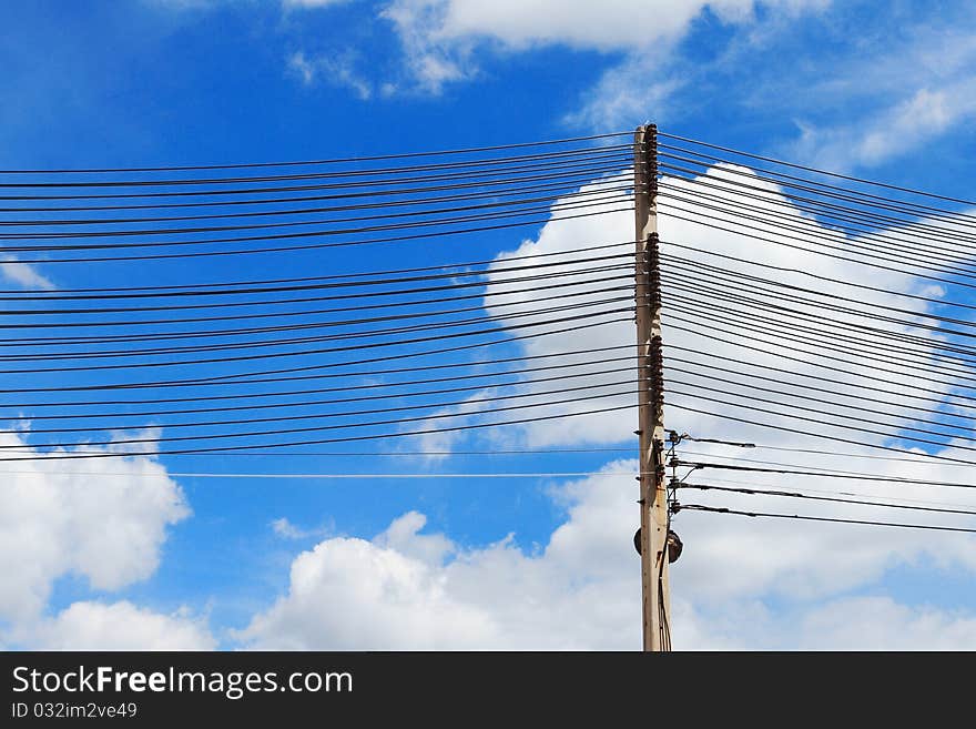 Electrical towers and power lines with blue sky background