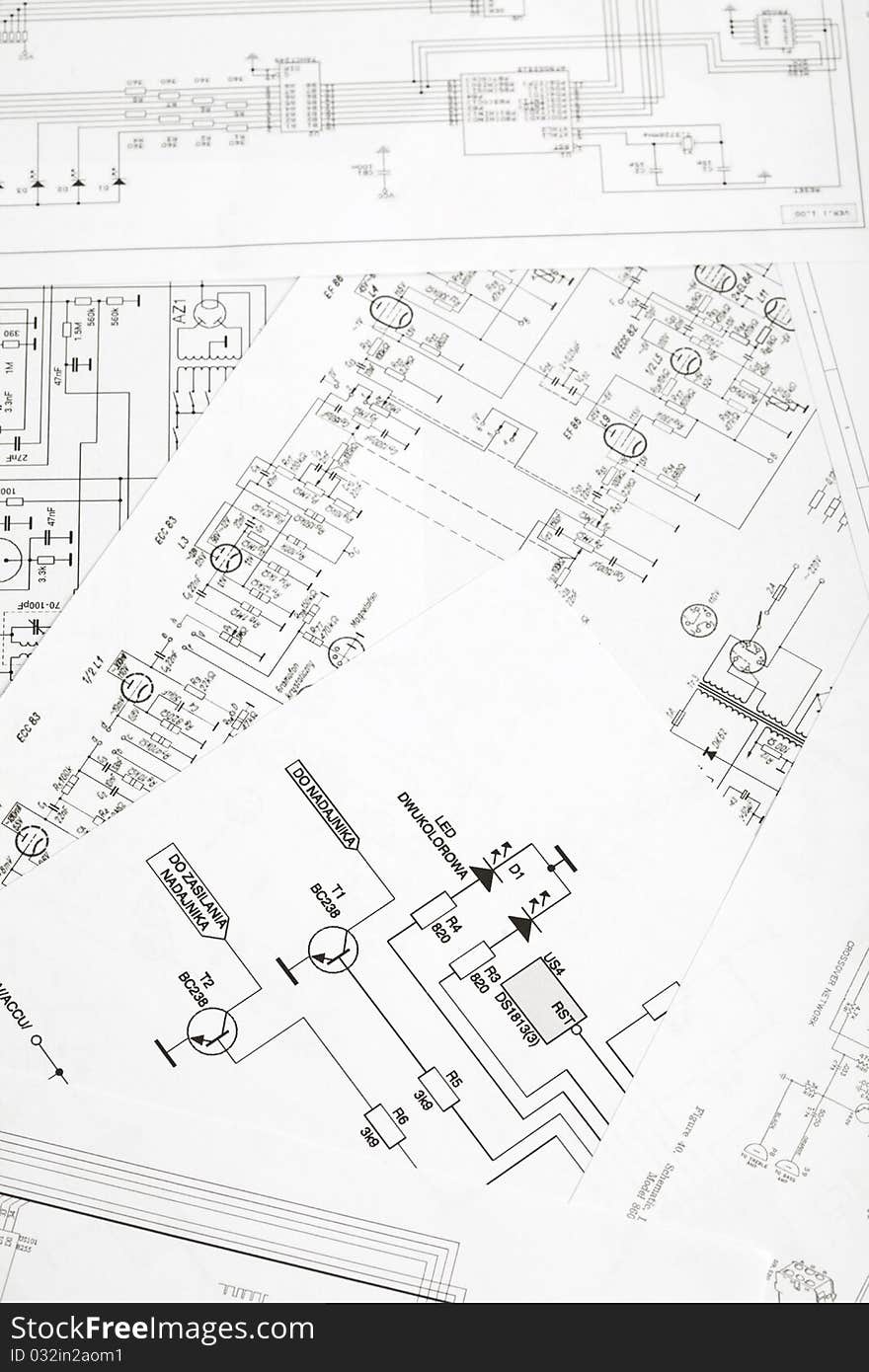 The approximation using a magnifying glass on the electronic schematic diagram.Ideal technology background.