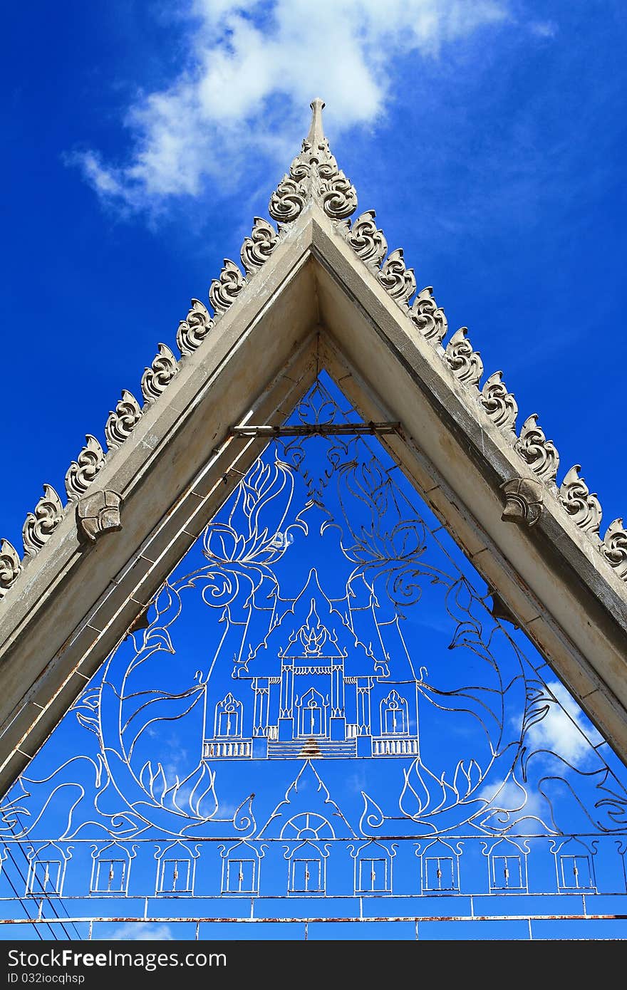 Thai style gate in temple and blue sky