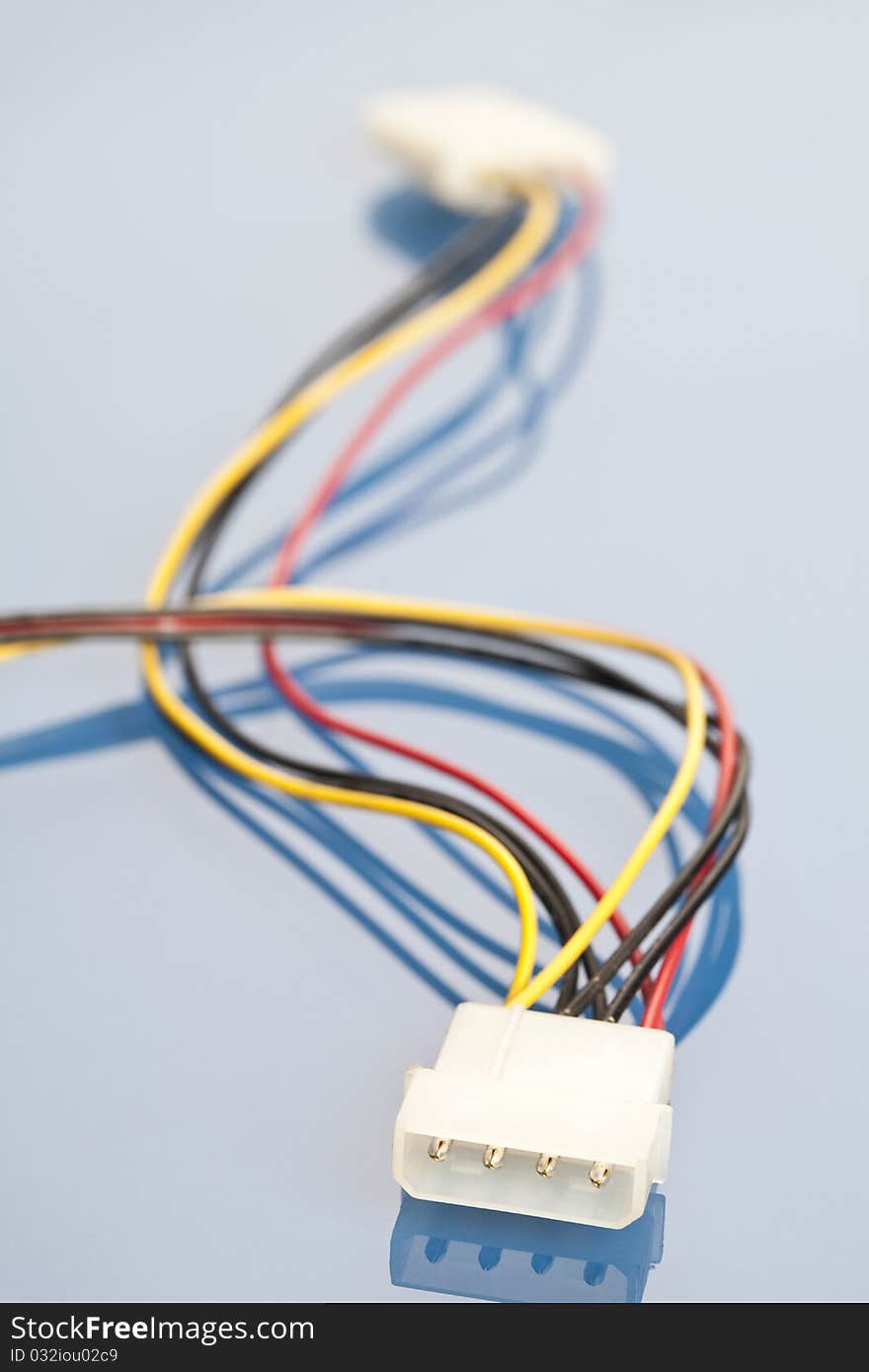 Colorful coils of cables on a blue background