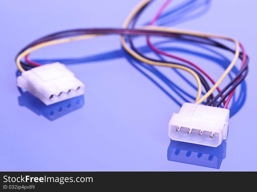 Colorful coils of cables on a blue background