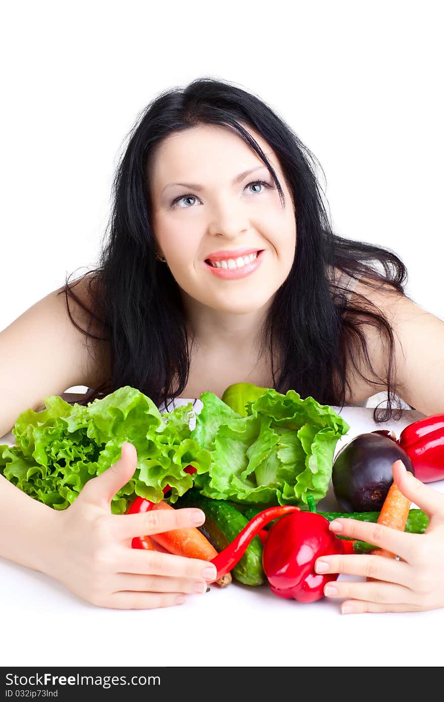 Beautiful woman  with vegetables over white background