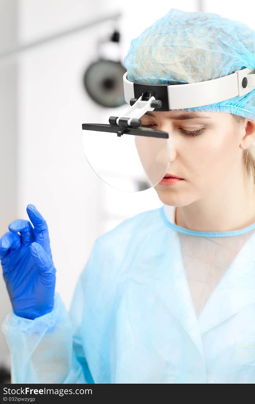 Beautiful woman doctor in uniform over window