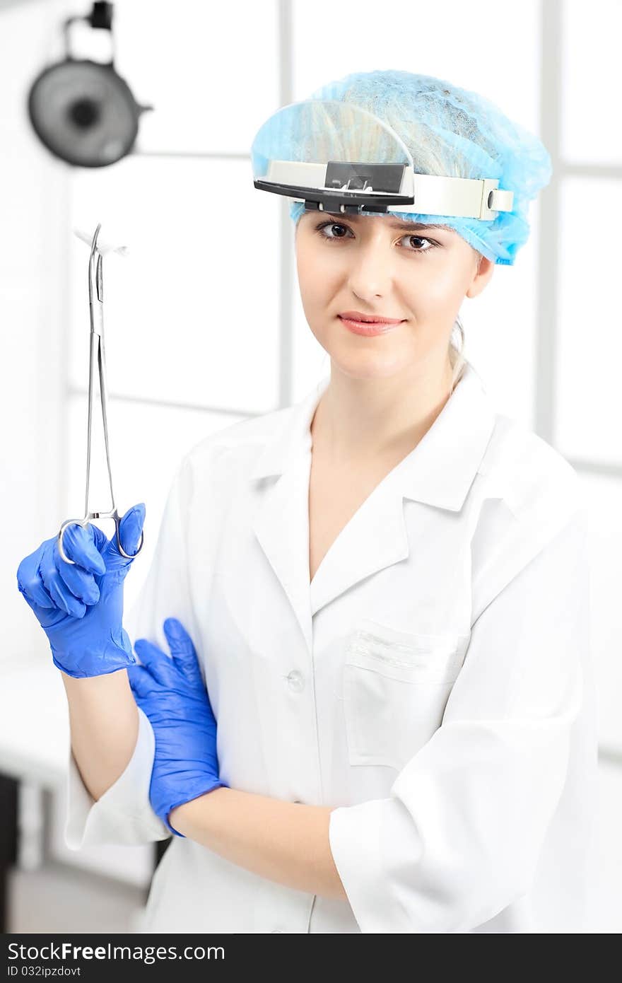 Woman doctor with blond hair in white. Woman doctor with blond hair in white