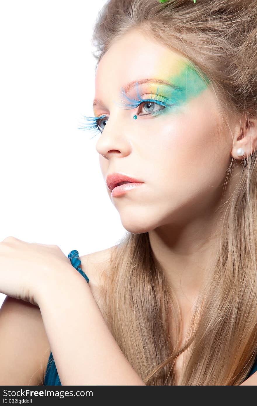 Beautiful woman  with color makeup over white background