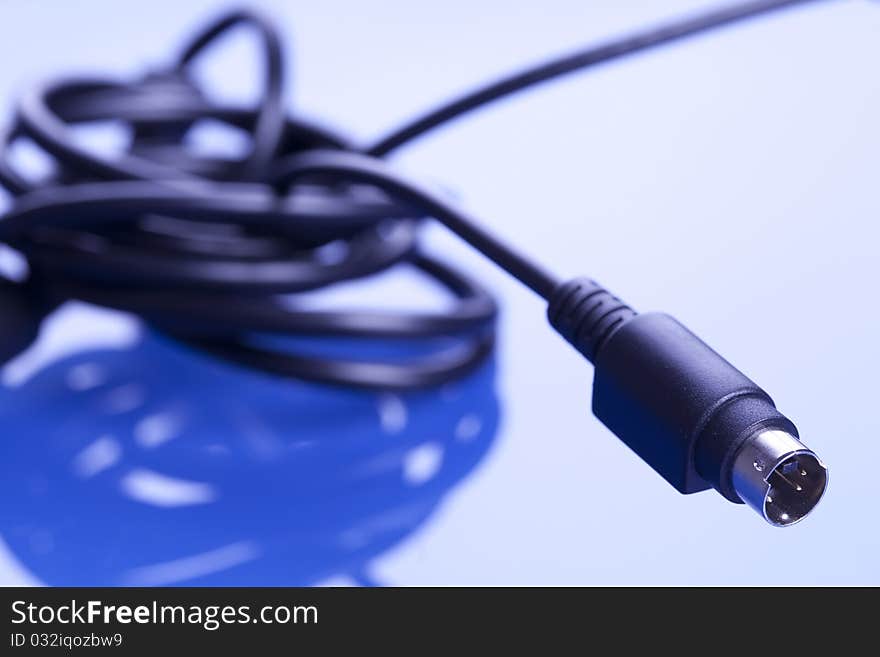 Colorful coils of cables on a blue background