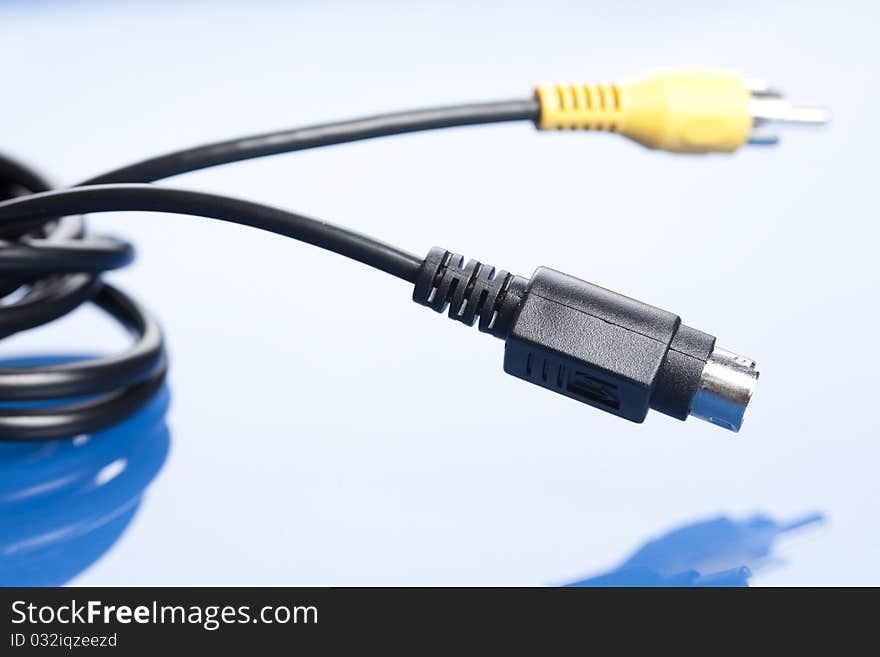 Colorful coils of cables on a blue background