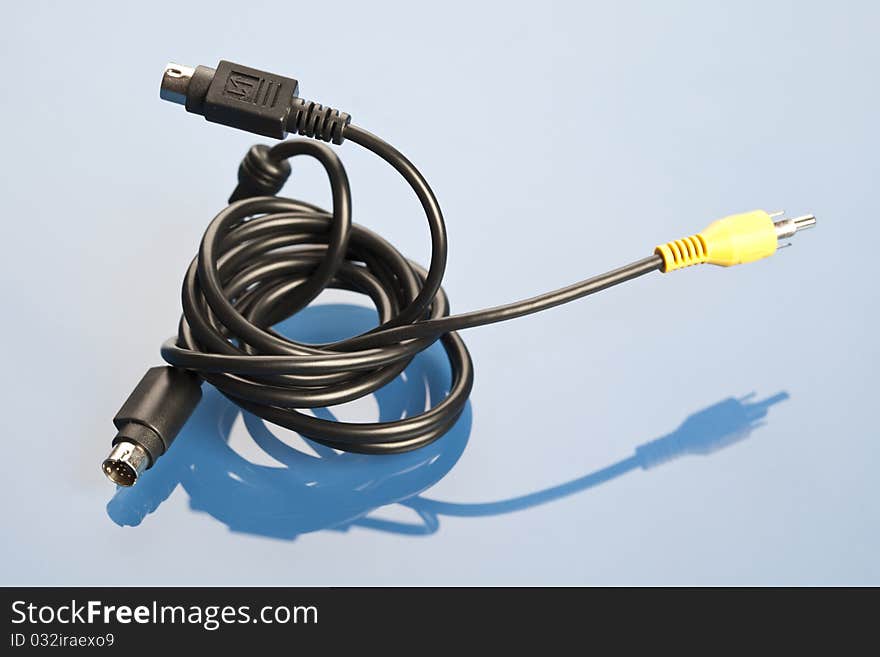 Colorful coils of cables on a blue background