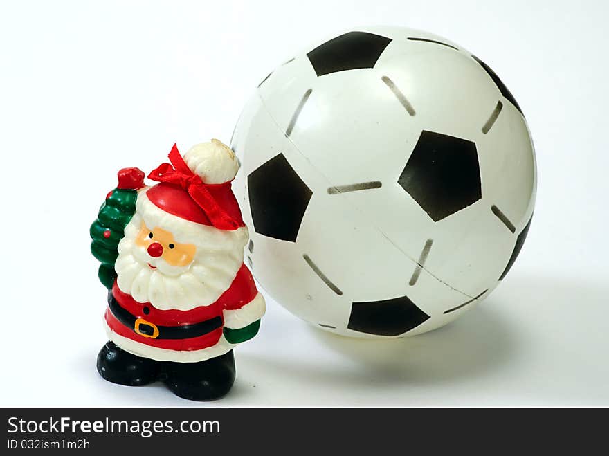 Santa Claus and the soccer ball on white