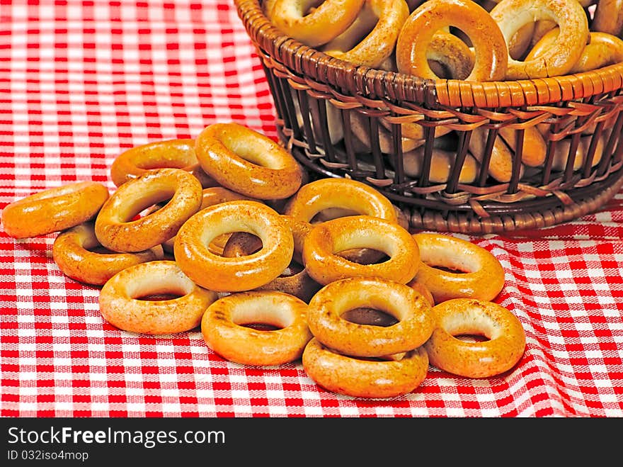 Basket with bread ring on a motley  background