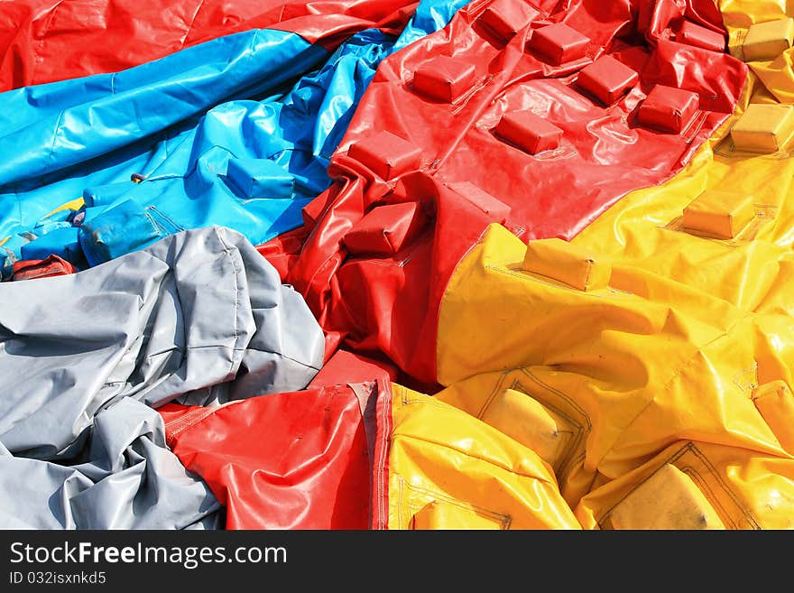 Colorful plastic tent on the ground