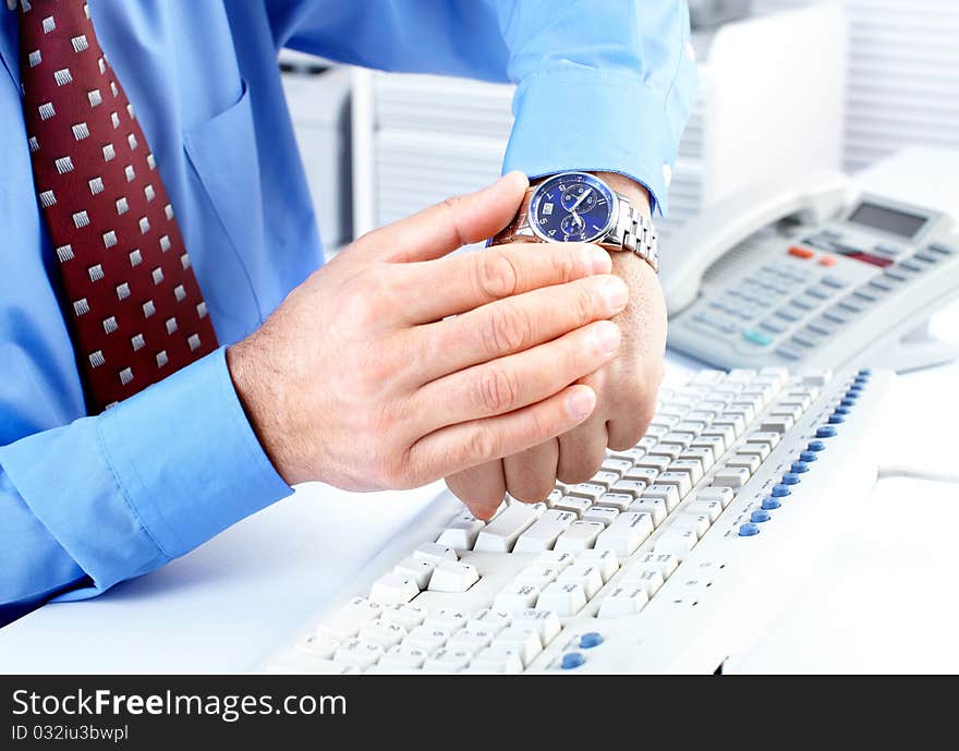 Businessman looking at the watch. Businessman looking at the watch