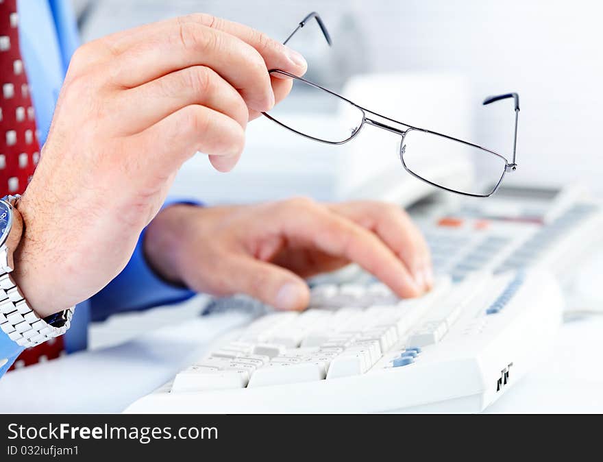 Male hands on a white keyboard. Male hands on a white keyboard