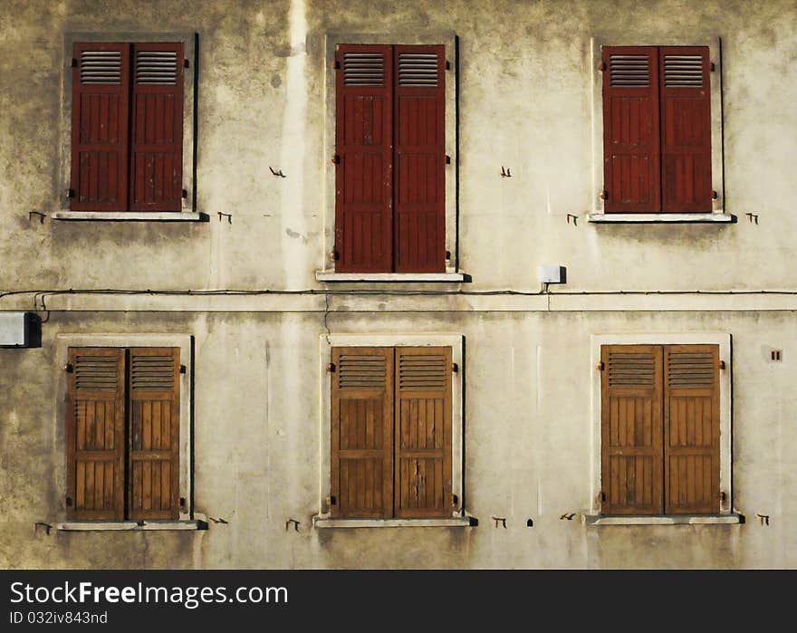 Shuttered windows on an old French building. Shuttered windows on an old French building.