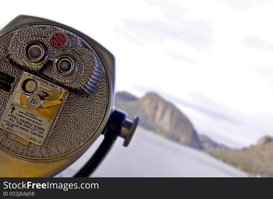 Binoculars overlooking desert mountains