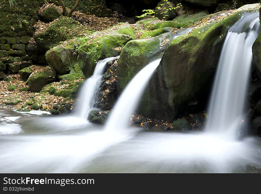 Autumn forest waterfall