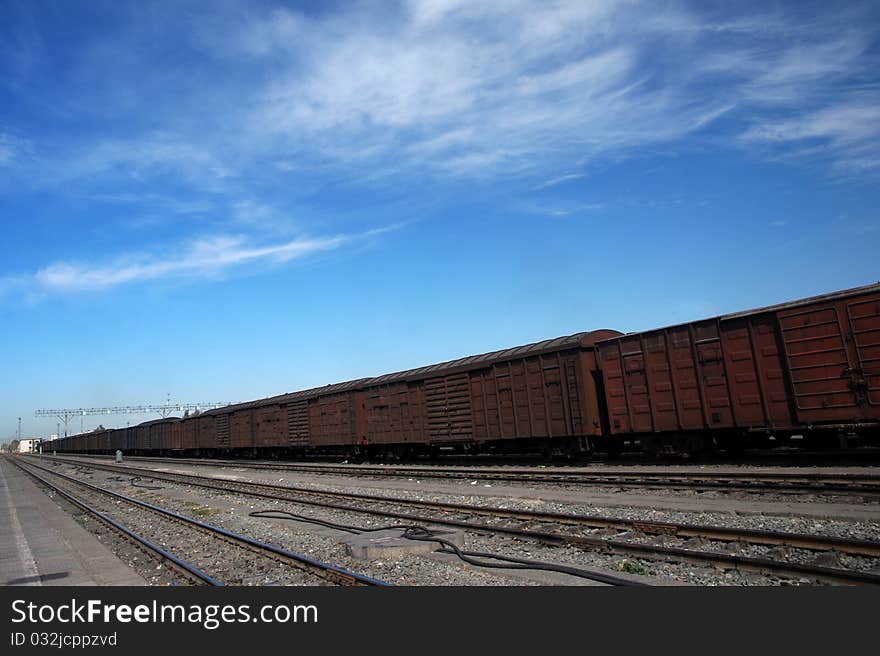 A train at the station under the blue sky.