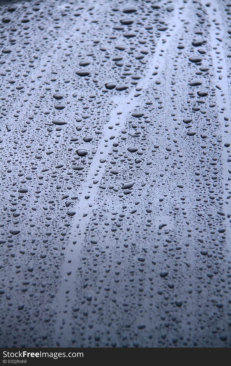 Raindrops on a surface of a car. Raindrops on a surface of a car