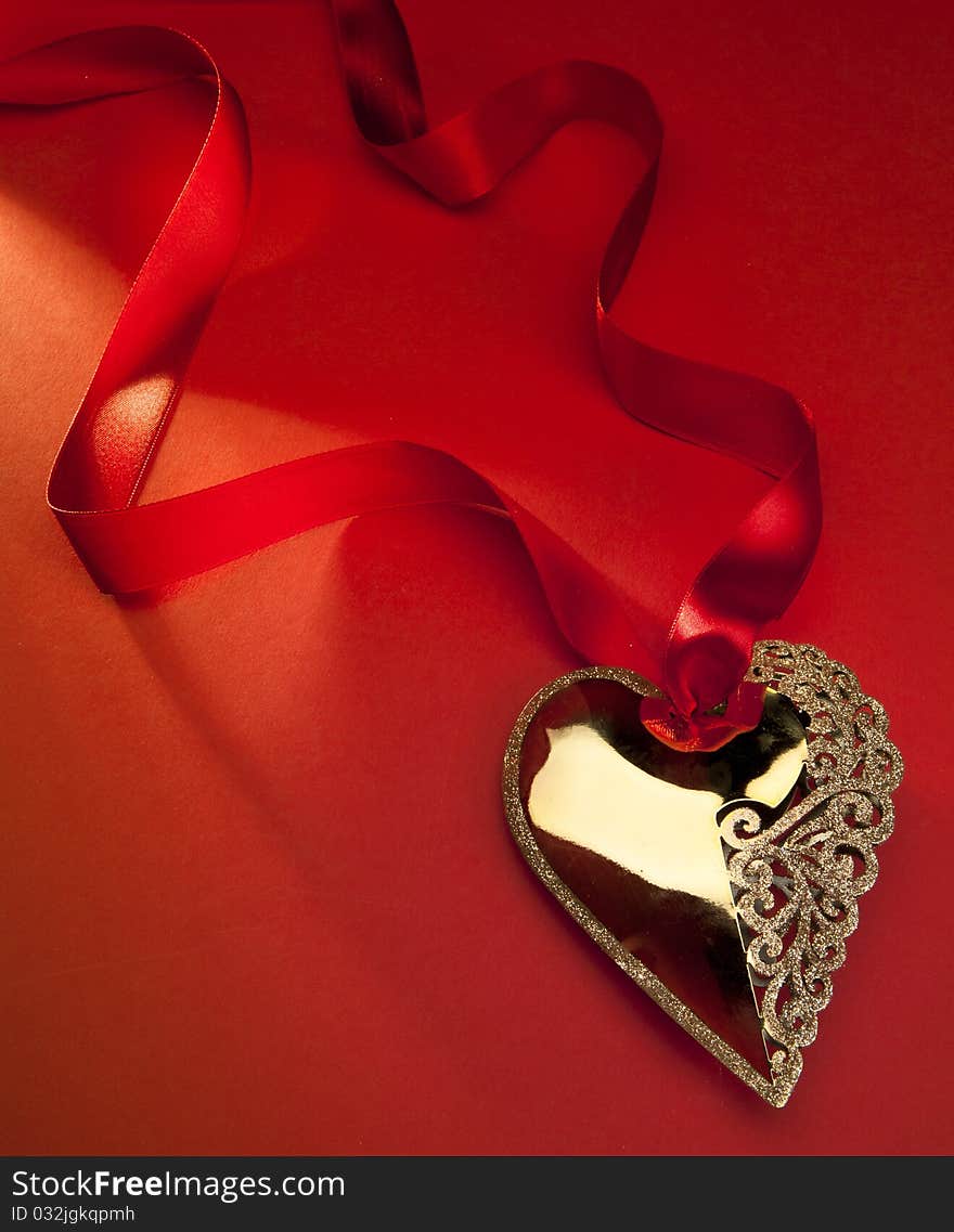 Christmas decoration Golden Heart with red ribbon. Christmas decoration Golden Heart with red ribbon