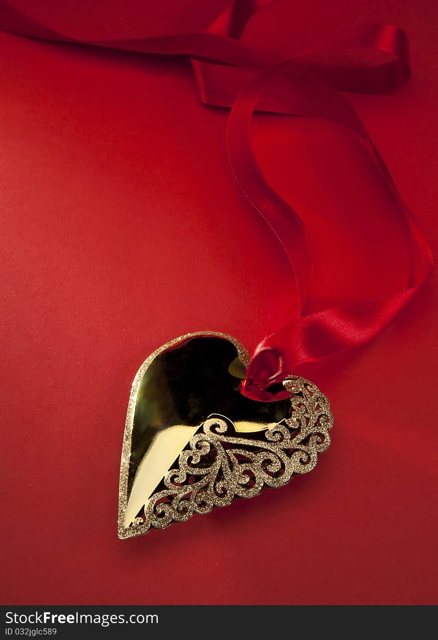 Christmas decoration Golden Heart with red ribbon. Christmas decoration Golden Heart with red ribbon