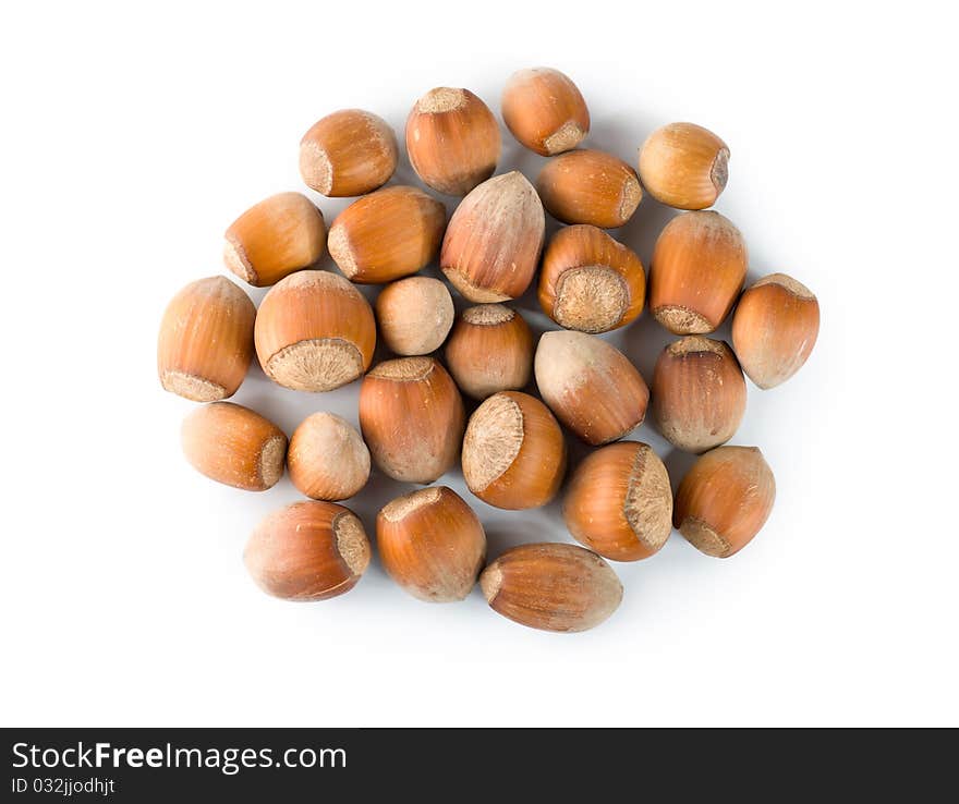 Heap of hazelnuts isolated on a white background