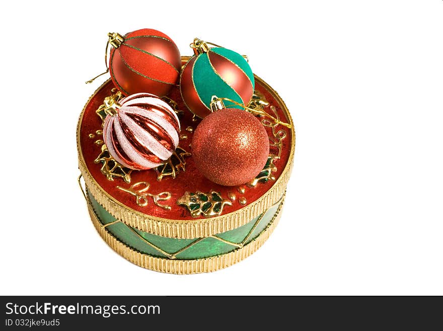 Ball shaped christmas ornaments on a decorative round box. Ball shaped christmas ornaments on a decorative round box