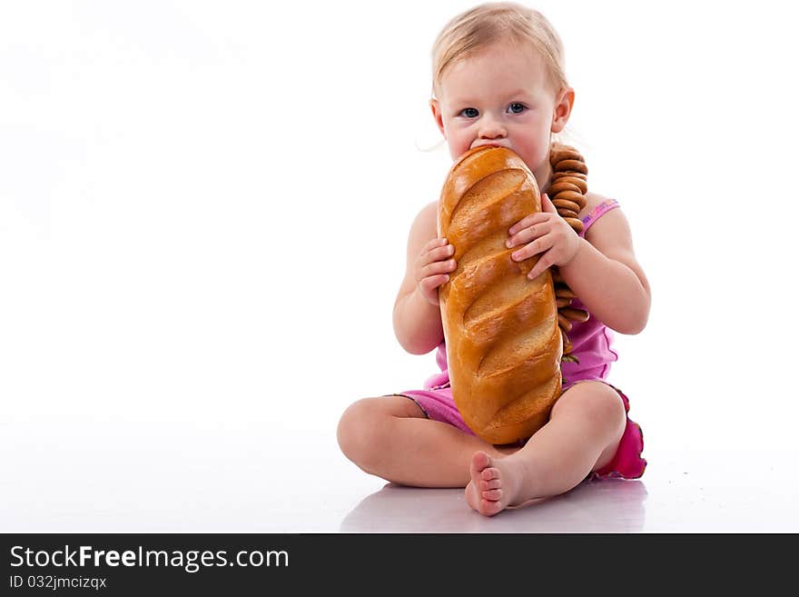 Baby biting a loaf of bread in roll beads