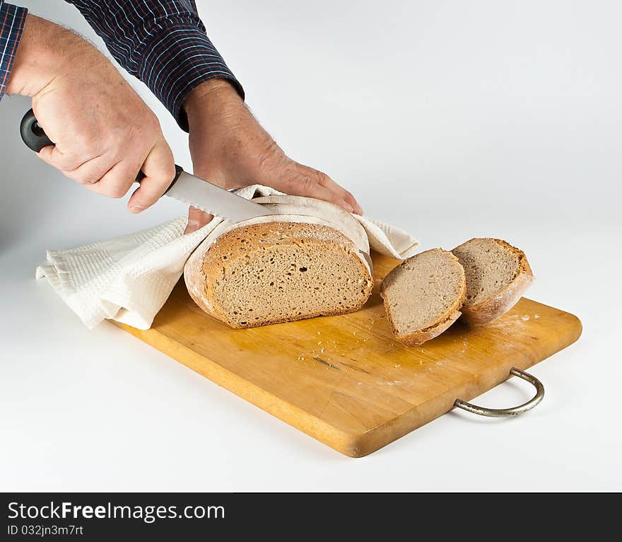 Cutting bwhite bread on chopping bjard. Cutting bwhite bread on chopping bjard