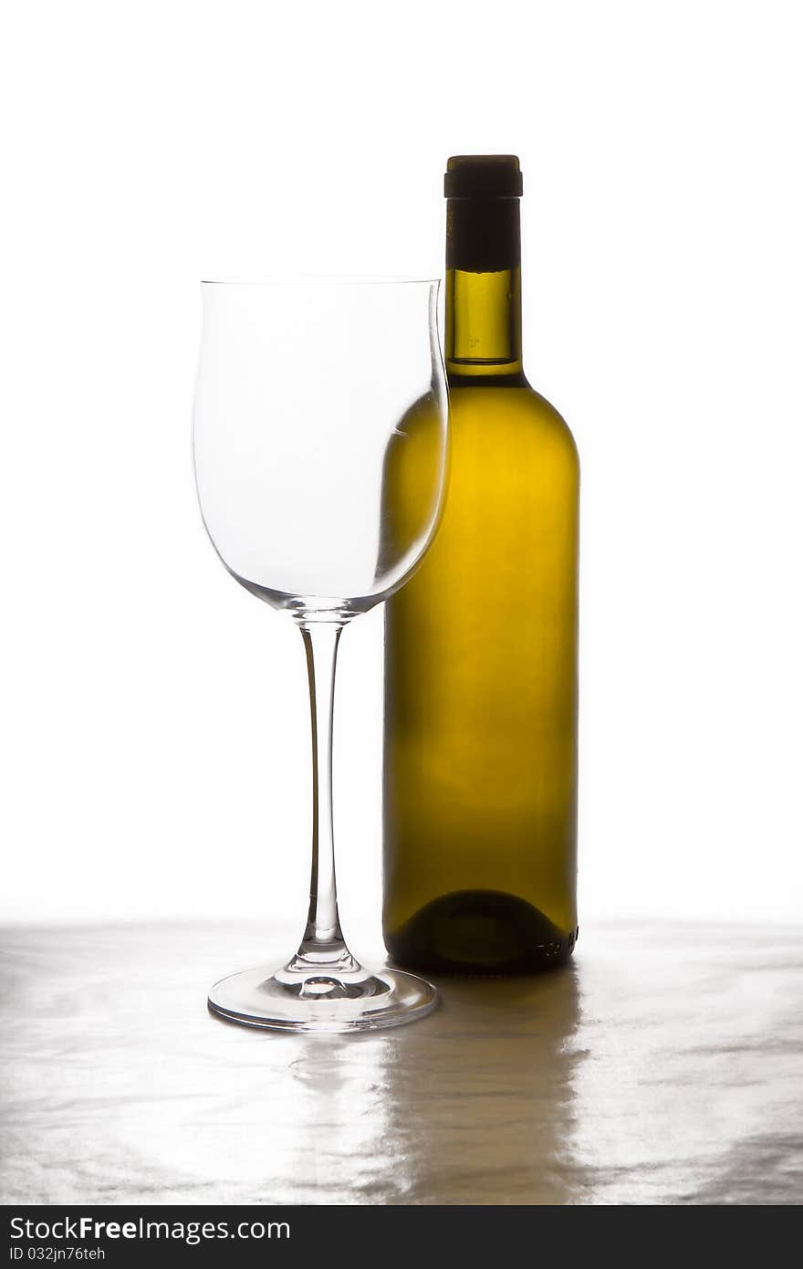 Bottle of white dty wine and winglass. Bottle of white dty wine and winglass