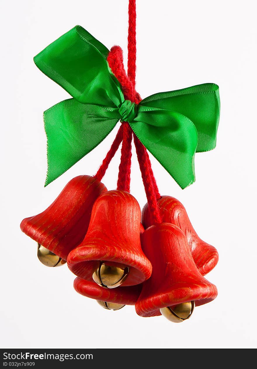 Red jingle bells with a green bow