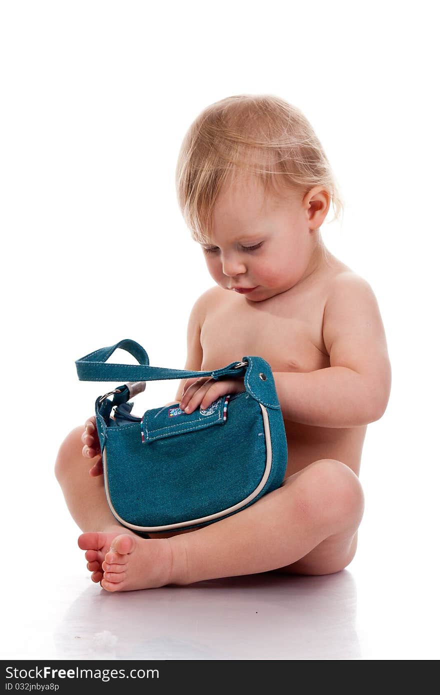 Baby looking into a small bag curious isolated on white