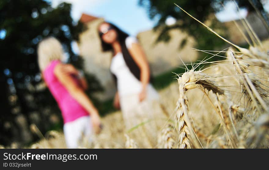 Two girls in wheat field