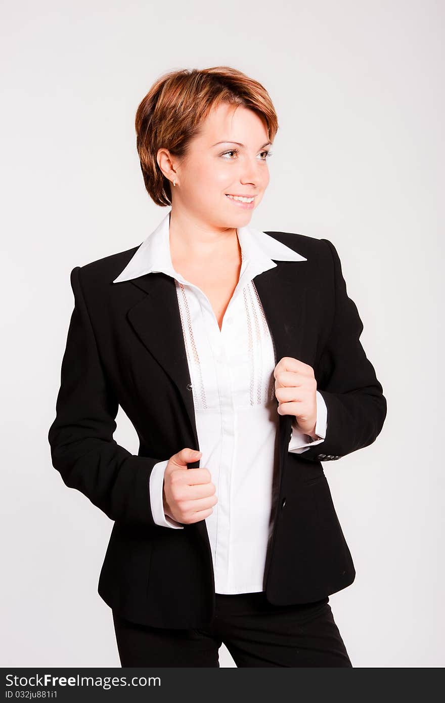 Beautiful business woman standing on light grey background