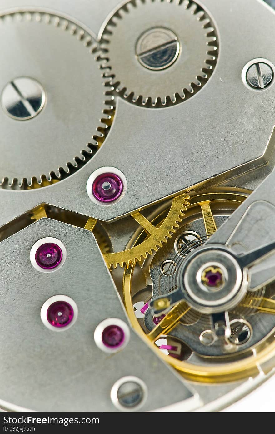 Open precise clockworks with big and small cogwheels. Open precise clockworks with big and small cogwheels