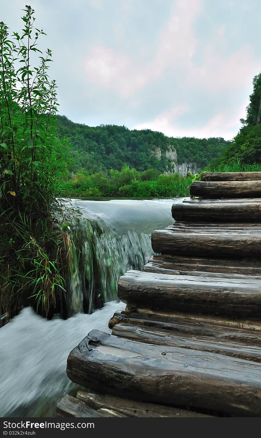 Wooden stair in spring forest near stream in mountains of croatia