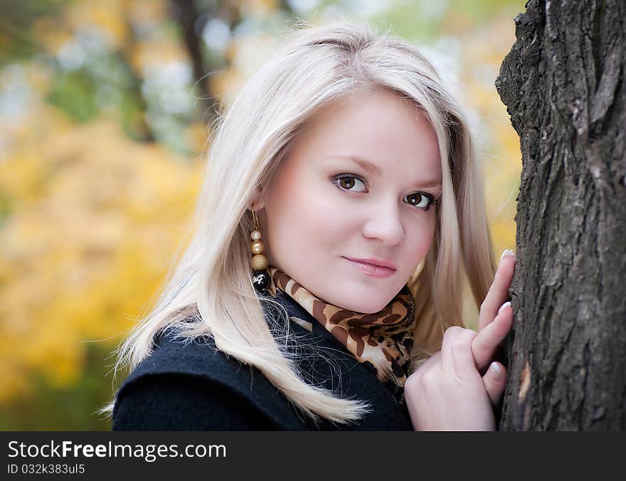 Beautiful blonde girl in autumn