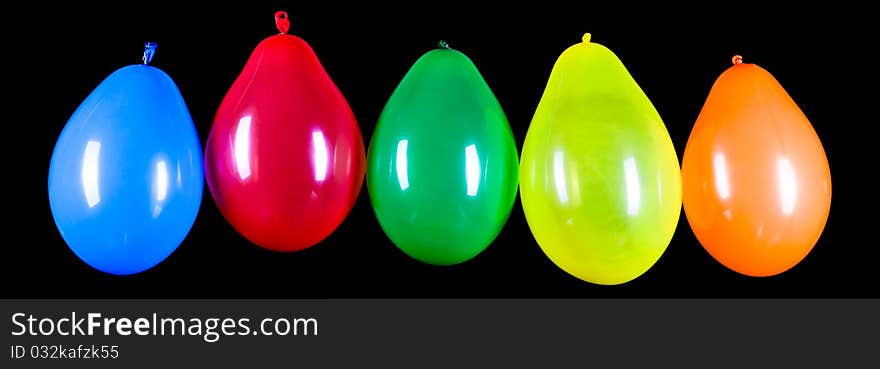 Colorful balloons on a black background