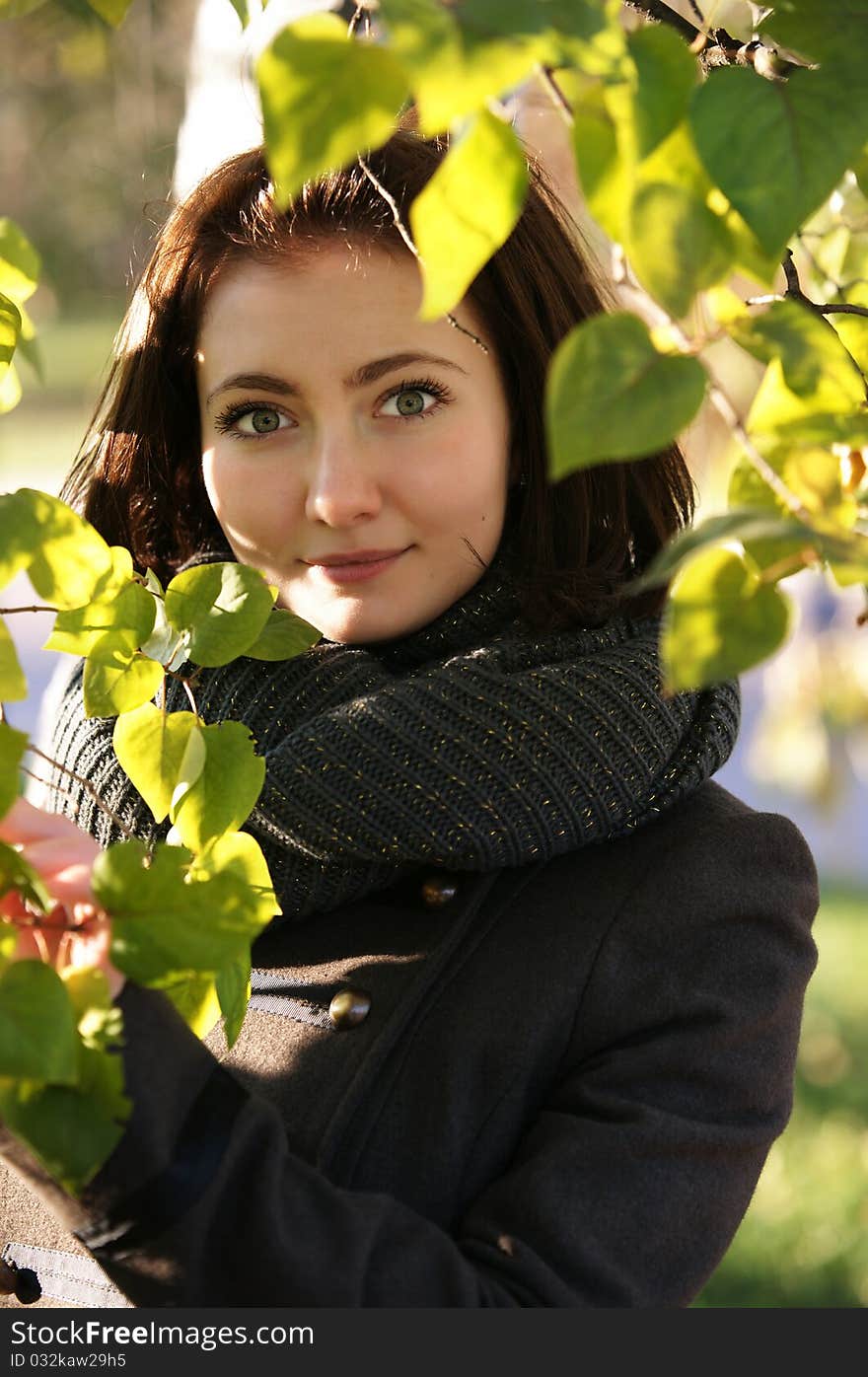 The girl against autumn leaves