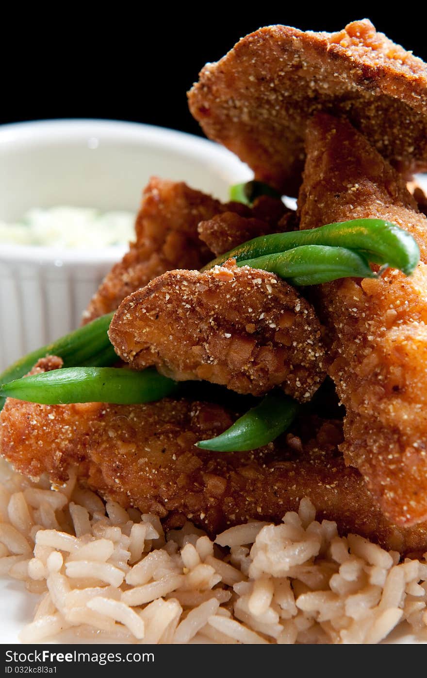 Fried fish over rice