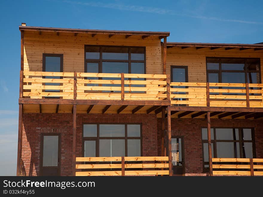 Newly built two-storeyed wooden and brick town house. Newly built two-storeyed wooden and brick town house