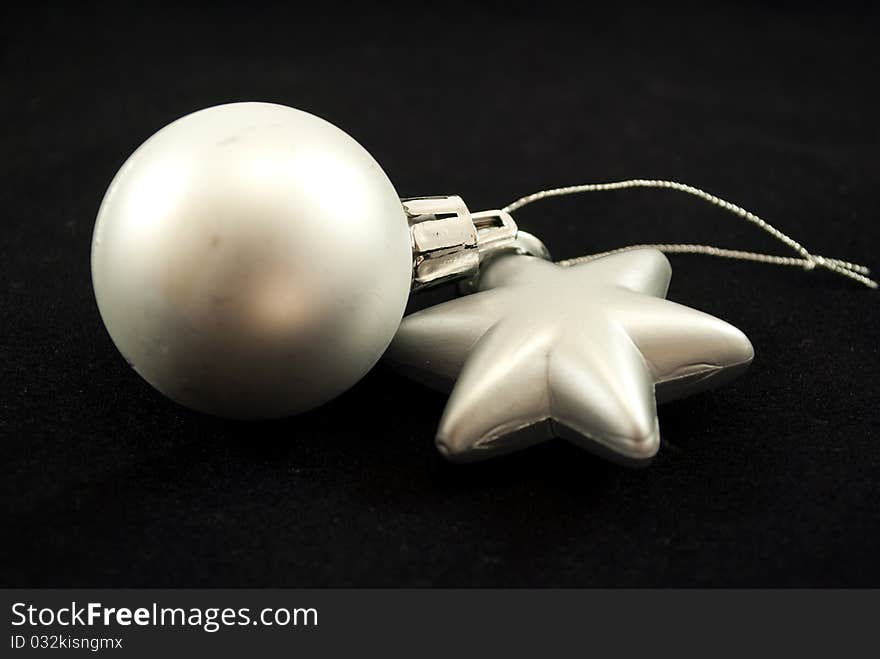 Christmas ornaments spotlight on black background