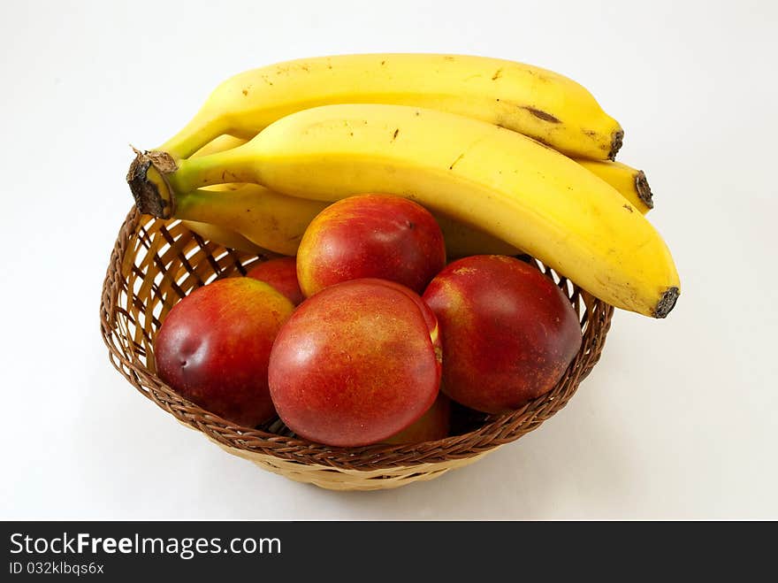 Basket with peaches and bananas. Basket with peaches and bananas