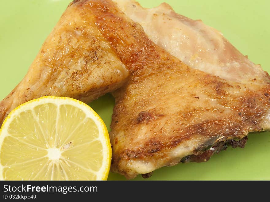 Roast chicken spotlight on green background. Roast chicken spotlight on green background