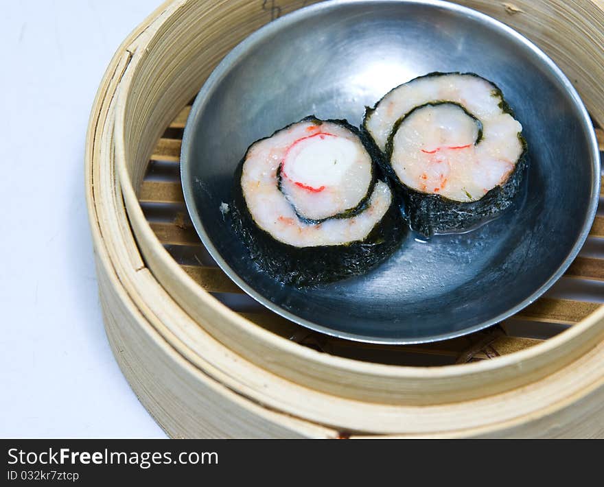 Chinese steamed dimsum in bamboo containers traditional cuisine. Chinese steamed dimsum in bamboo containers traditional cuisine