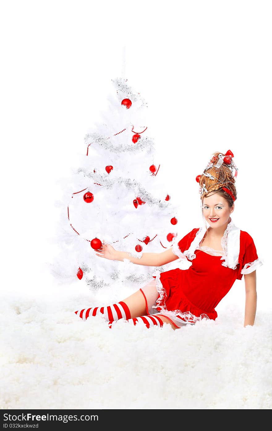 Beautiful young woman in Santa Claus clothes isolated over white background. Christmas. Beautiful young woman in Santa Claus clothes isolated over white background. Christmas.