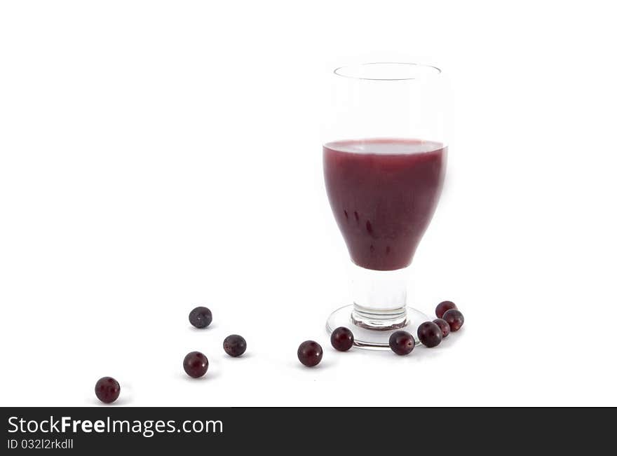 Glass of grape juices and grapes isolated on white background