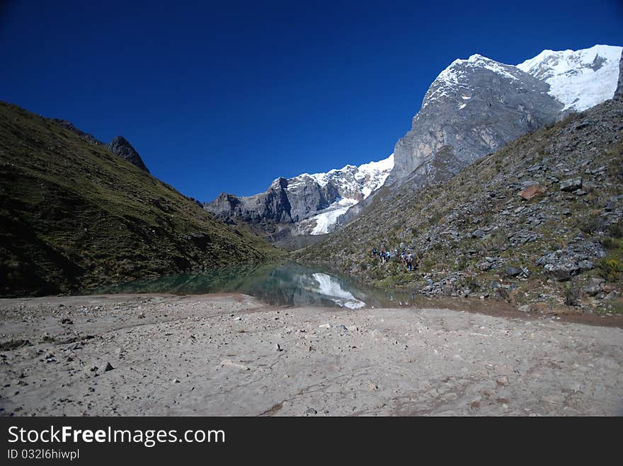 Azure lake with mountain reflection